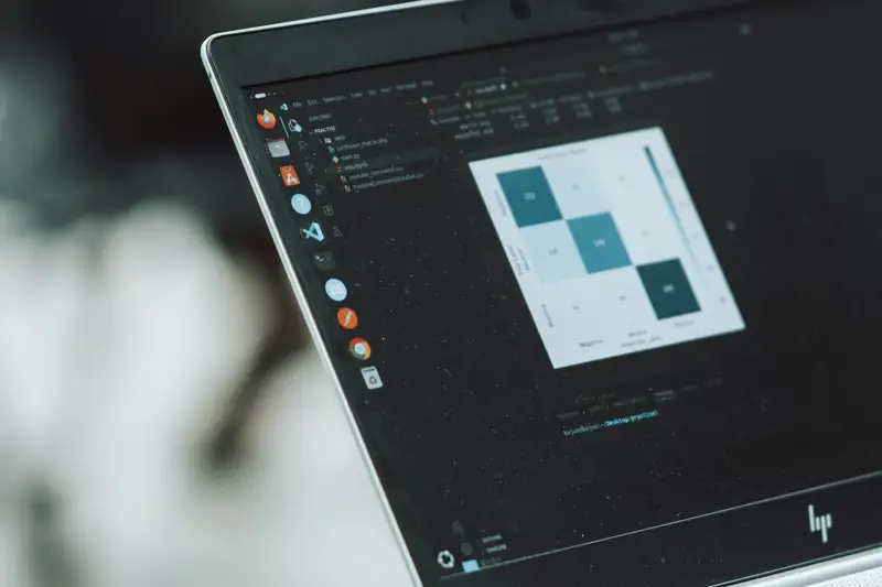 Laptop showing data analysis charts, illustrating marketing budget planning